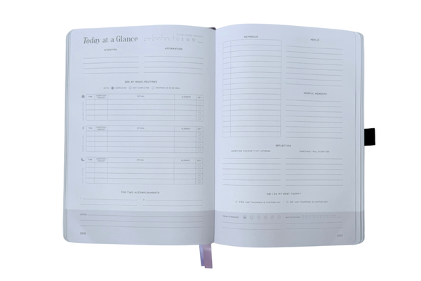 Open planner with daily schedule on a white background